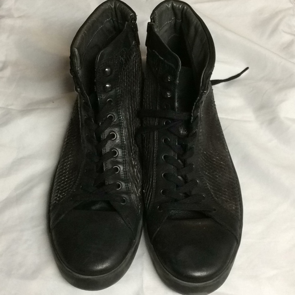 Brusque black leather faux hitop lace up sneakers.
